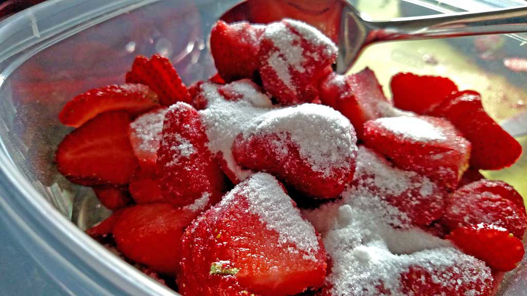 sugar coated strawberries in a bowl