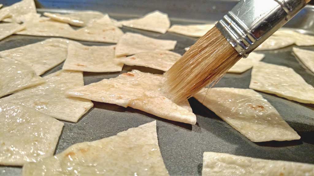 Baked Tortilla Chips: Crispy and crunchy these tortilla chips are oven baked and you are in control of all seasonings. | TheMountainKitchen.com