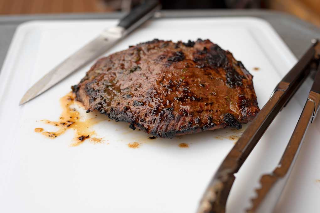 carne asada resting on cutting board