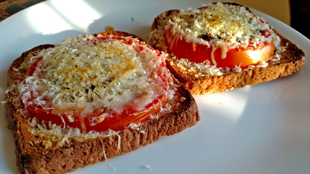 This open-face Caprese Sandwich is perfect for a quick summer meal, toasted bread with tomato slices, basil, mozzarella and parmesan cheese. | TheMountainKitchen.com