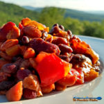 Smoky Pineapple Baked Beans with bacon and chipotle chile pepper, pineapple, red pepper, with hints of barbecue sauce and beer that round out the flavors. | TheMountainKitchen.com
