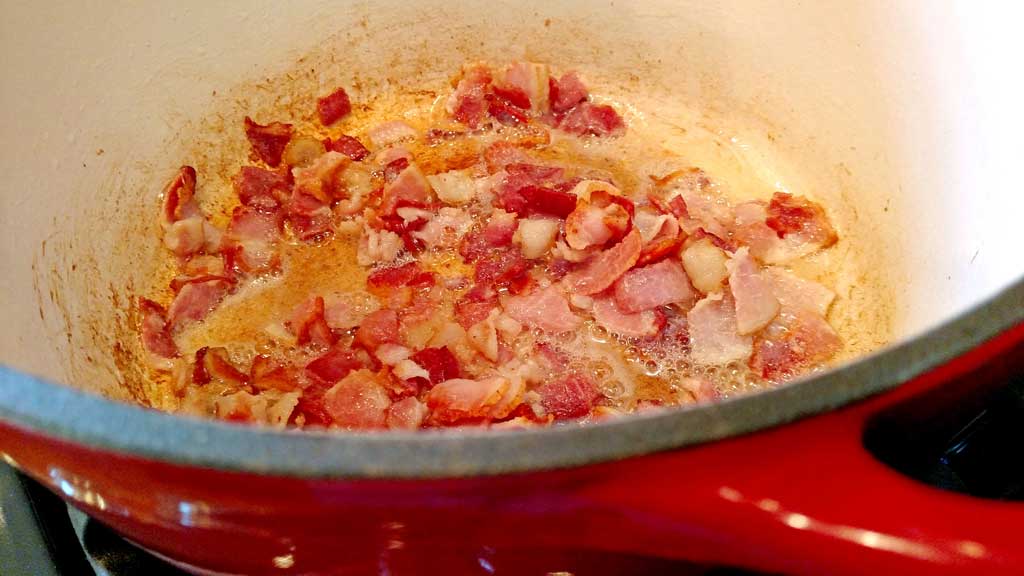 Smoky Pineapple Baked Beans with bacon and chipotle chile pepper, pineapple, red pepper, with hints of barbecue sauce and beer that round out the flavors. | TheMountainKitchen.com