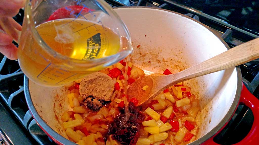 Smoky Pineapple Baked Beans with bacon and chipotle chile pepper, pineapple, red pepper, with hints of barbecue sauce and beer that round out the flavors. | TheMountainKitchen.com
