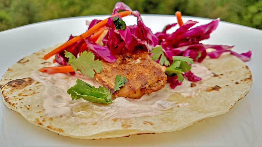 The Mountain Kitchen Fish Tacos are made with seared mahi-mahi, on a tortilla dressed with chipotle sour cream and topped with a light, fresh citrus slaw. | TheMountainKitchen.com