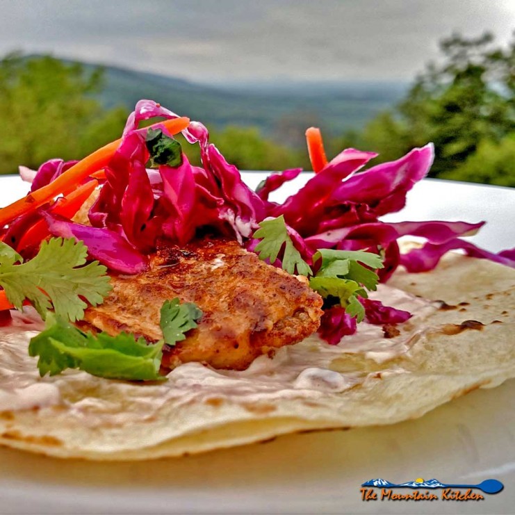 The Mountain Kitchen Fish Tacos are made with seared mahi-mahi, on a tortilla dressed with chipotle sour cream and topped with a light, fresh citrus slaw. | TheMountainKitchen.com