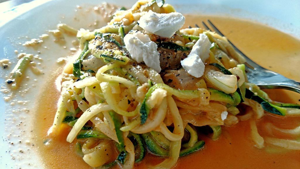 Zucchini noodles with creamy roasted red pepper sauce is a flavorful alternative if you have special dietary needs or just trying to dodge carbs. | TheMountainKitchen.com