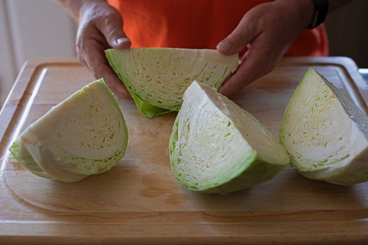 cabbage wedges on cutting board