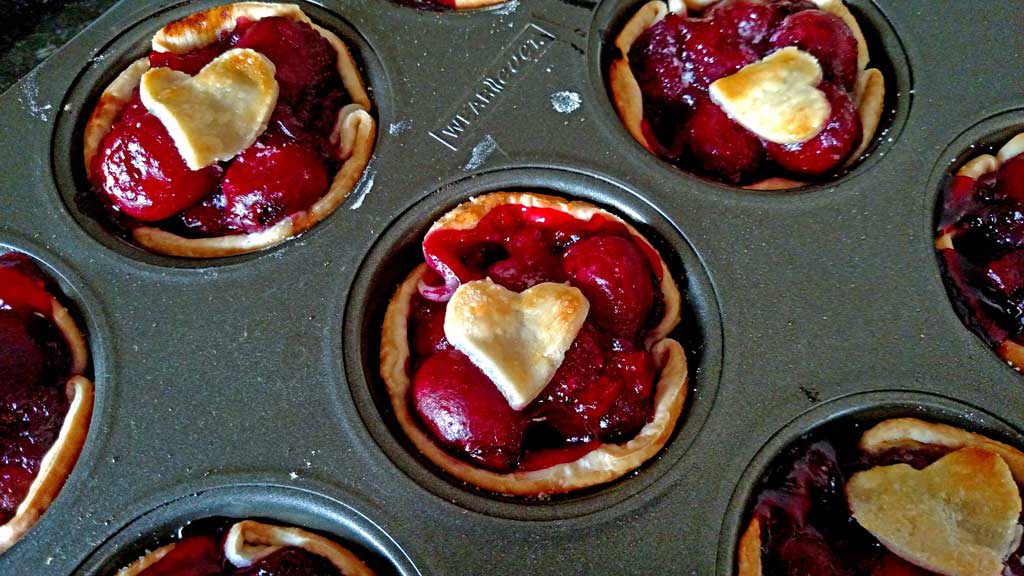 Easy to make, with fresh sweet cherries, these easy mini cherry pies are just as delicious as a full size pie, only cuter! | TheMountainKitchen.com