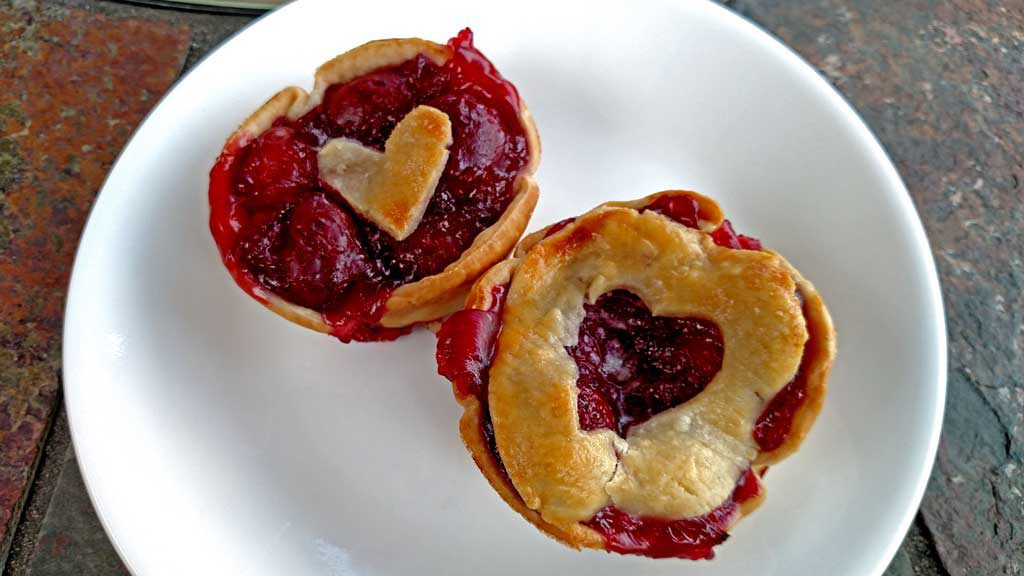 Easy to make, with fresh sweet cherries, these easy mini cherry pies are just as delicious as a full size pie, only cuter! | TheMountainKitchen.com