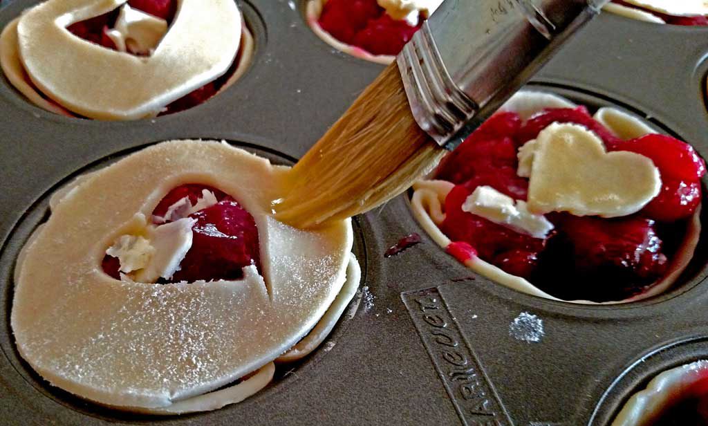 Easy to make, with fresh sweet cherries, these easy mini cherry pies are just as delicious as a full size pie, only cuter! | TheMountainKitchen.com