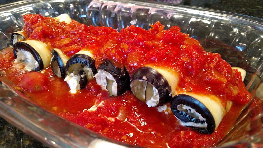 eggplant rollatini with tomato sauce on top