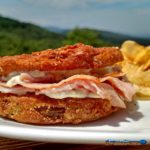 Firm tangy, crisp fried green tomato slices take on a whole new meaning with salty ham and sour mayo dressing in these fried green tomato sandwiches. | TheMountainKitchen.com