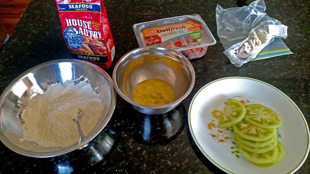 Firm tangy, crisp fried green tomato slices take on a whole new meaning with salty ham and sour mayo dressing in these fried green tomato sandwiches. | TheMountainKitchen.com
