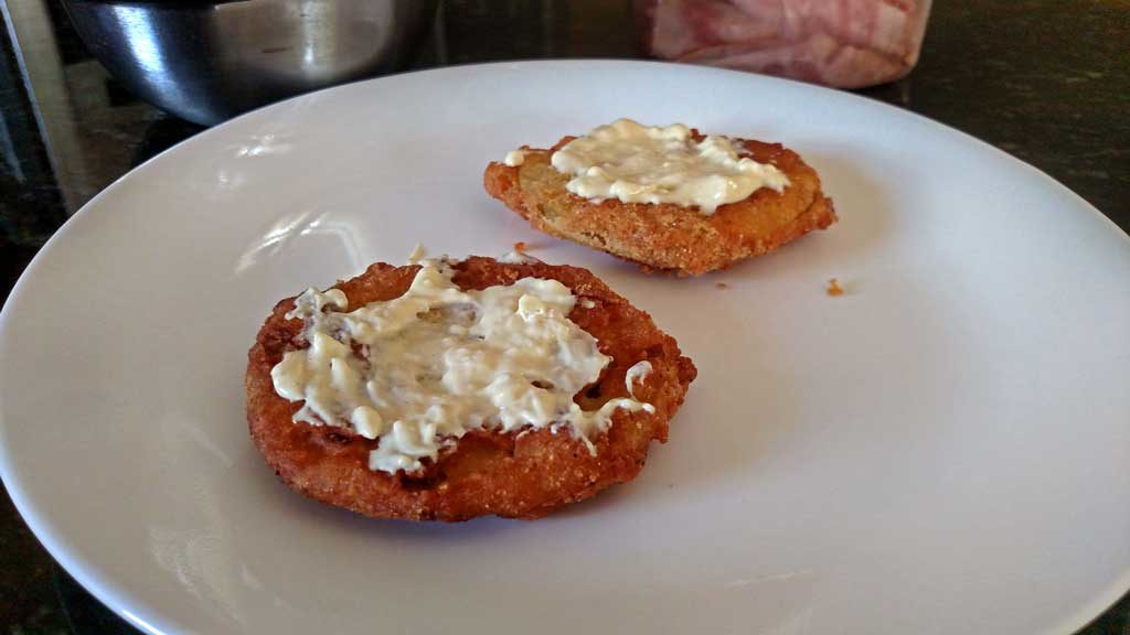 Firm tangy, crisp fried green tomato slices take on a whole new meaning with salty ham and sour mayo dressing in these fried green tomato sandwiches. | TheMountainKitchen.com