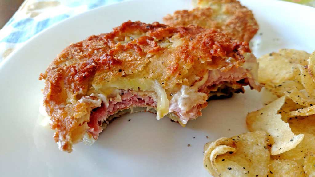 Firm tangy, crisp fried green tomato slices take on a whole new meaning with salty ham and sour mayo dressing in these fried green tomato sandwiches. | TheMountainKitchen.com