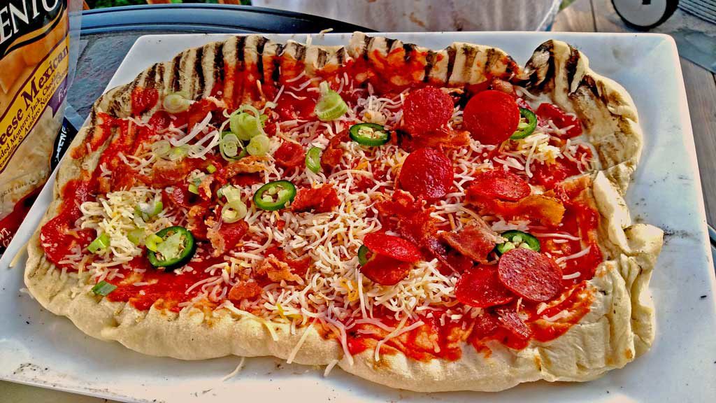 How to make grilled pizza on a charcoal grill. | TheMountainKitchen.com