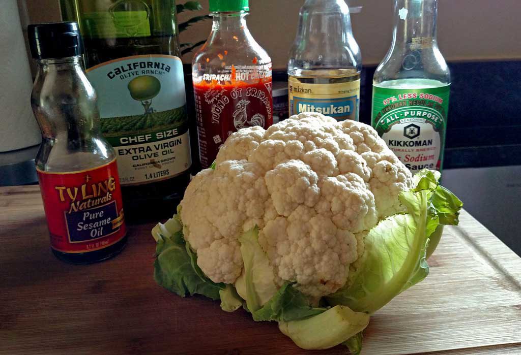 This recipe for sriracha roasted cauliflower uses delicious cauliflower, with a kick, kind of like a "meatless buffalo wing" for Meatless Monday. | TheMountainKitchen.com