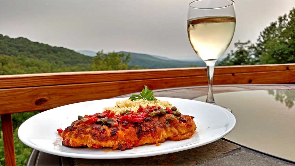 Sun-Dried Tomato Crusted Chicken is a delight! The breast are lightly battered in a sun-dried tomato crust, topped with a rich and tangy sunny butter sauce. | TheMountainKitchen.com