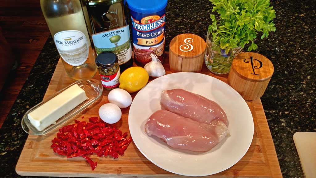 Sun-Dried Tomato Crusted Chicken is a delight! The breast are lightly battered in a sun-dried tomato crust, topped with a rich and tangy sunny butter sauce. | TheMountainKitchen.com