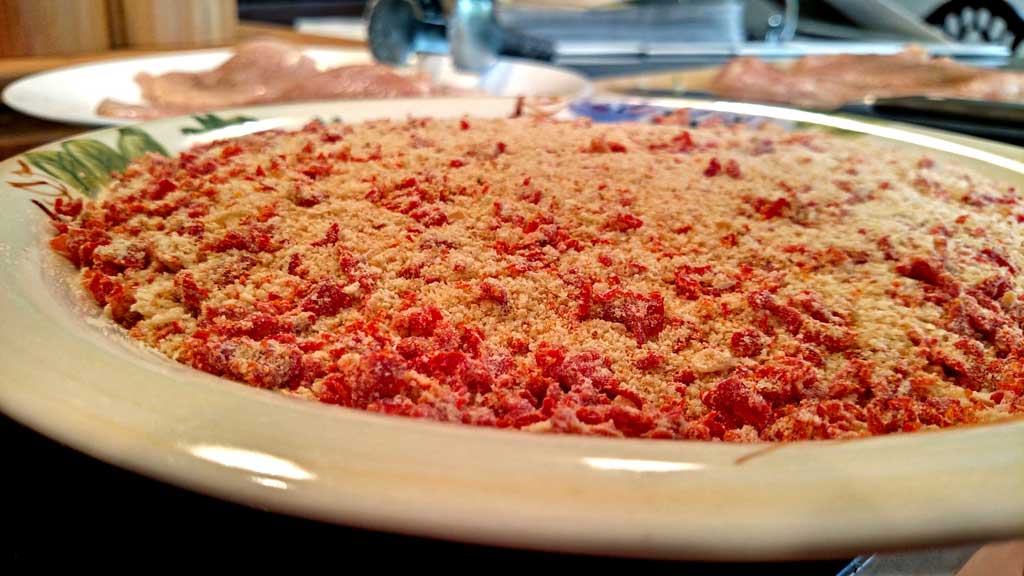 Sun-Dried Tomato Crusted Chicken is a delight! The breast are lightly battered in a sun-dried tomato crust, topped with a rich and tangy sunny butter sauce. | TheMountainKitchen.com