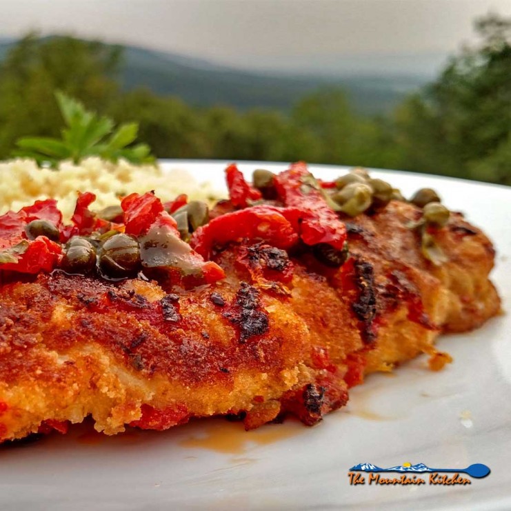 Sun-Dried Tomato Crusted Chicken is a delight! The breast are lightly battered in a sun-dried tomato crust, topped with a rich and tangy sunny butter sauce. | TheMountainKitchen.com