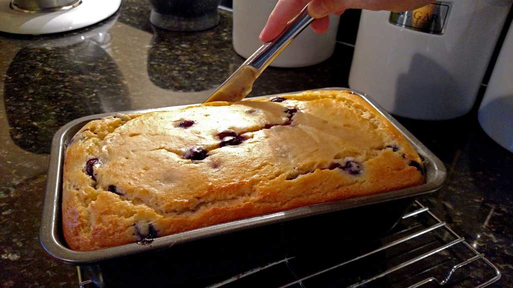 This Blueberry Lemon Yogurt Loaf captured that hot summer morning picking blueberries at my mama’s house perfectly. This loaf has quite the zing to it and it is bursting with lemon flavor and fresh blueberries. It practically melts in your mouth and I am sure it would bring warm summer thoughts to your mind even in the dead of winter! | TheMountainKitchen.com