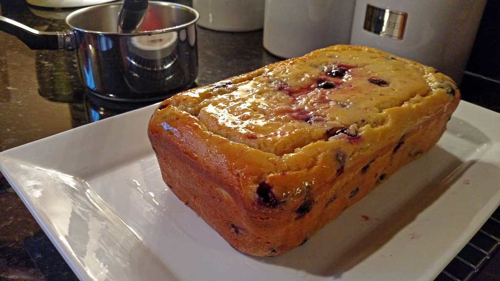 This Blueberry Lemon Yogurt Loaf captured that hot summer morning picking blueberries at my mama’s house perfectly. This loaf has quite the zing to it and it is bursting with lemon flavor and fresh blueberries. It practically melts in your mouth and I am sure it would bring warm summer thoughts to your mind even in the dead of winter! | TheMountainKitchen.com