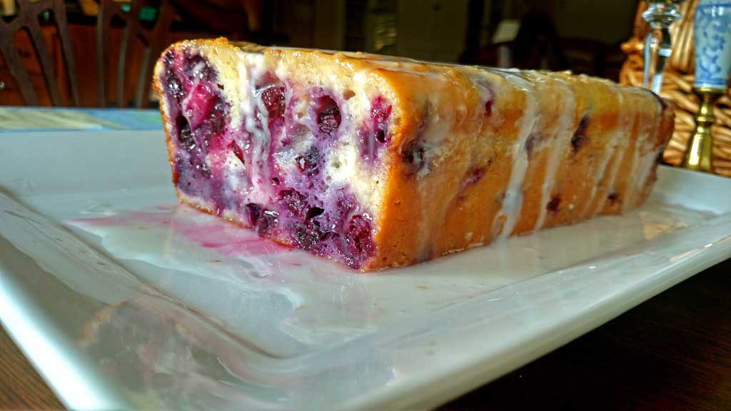 This Blueberry Lemon Yogurt Loaf captured that hot summer morning picking blueberries at my mama’s house perfectly. This loaf has quite the zing to it and it is bursting with lemon flavor and fresh blueberries. It practically melts in your mouth and I am sure it would bring warm summer thoughts to your mind even in the dead of winter! | TheMountainKitchen.com