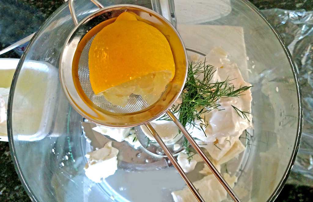 squeezing lemon juice into foodprocessor