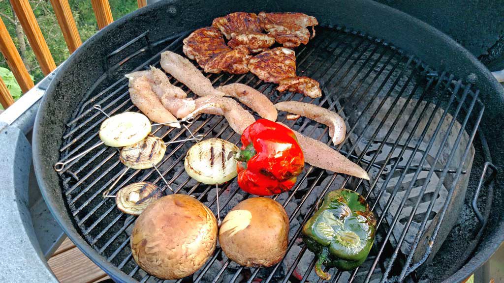 These delicious grilled chicken fajitas are a breeze to make with grilled chicken thighs with Mexican spices served with grilled vegetables on a tortilla. | TheMountainKitchen.com