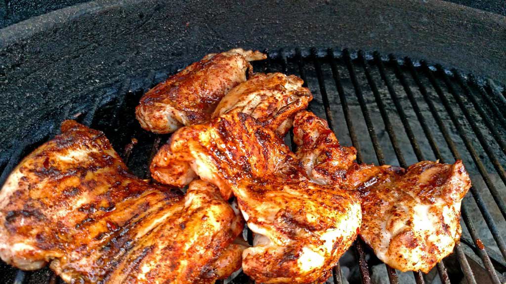 These delicious grilled chicken fajitas are a breeze to make with grilled chicken thighs with Mexican spices served with grilled vegetables on a tortilla. | TheMountainKitchen.com