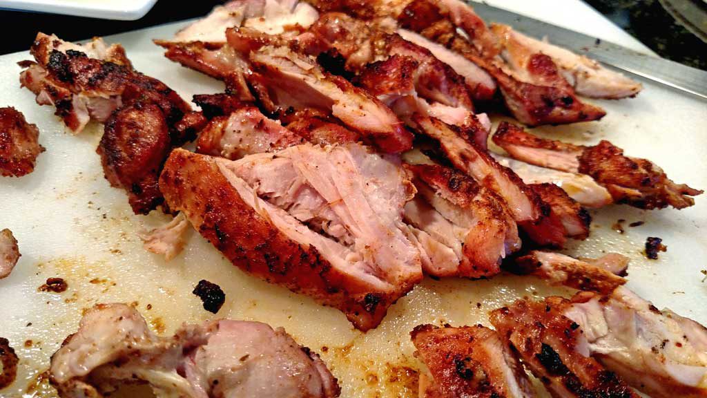These delicious grilled chicken fajitas are a breeze to make with grilled chicken thighs with Mexican spices served with grilled vegetables on a tortilla. | TheMountainKitchen.com