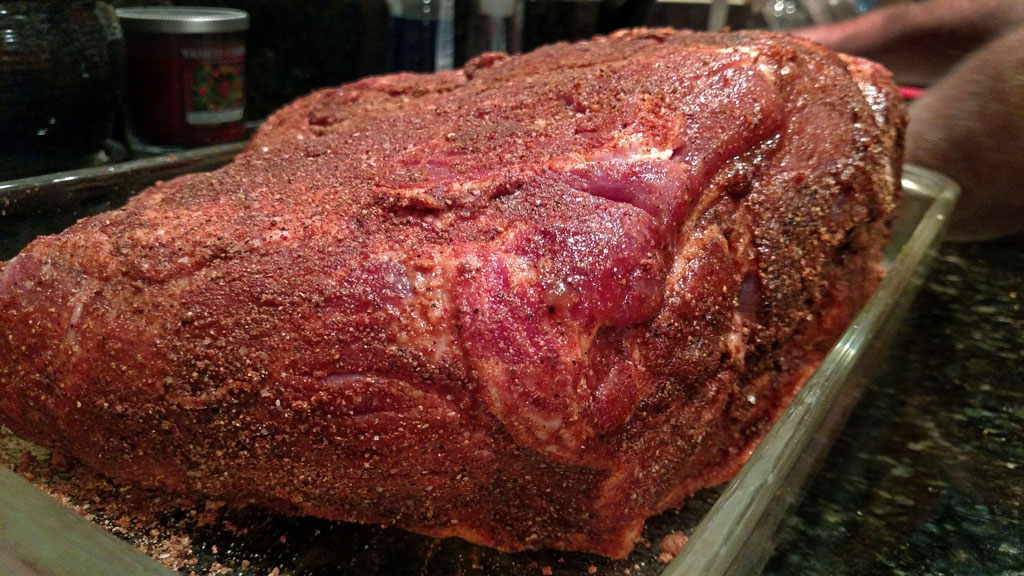 rubbed pork butt ready for smoker