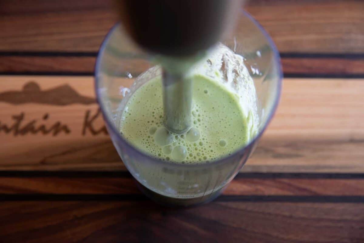 hand blender blending vinaigrette
