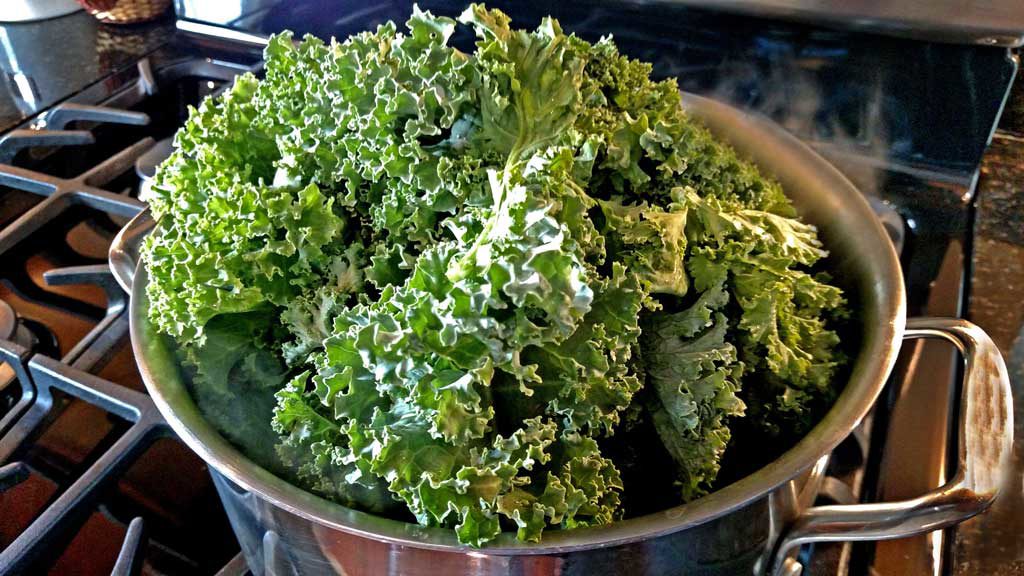 This great southern style Sunday supper may take a little time, but these Kale Stuffed Pork Chops have the potential to change the minds of green-haters. | TheMountainKitchen.com