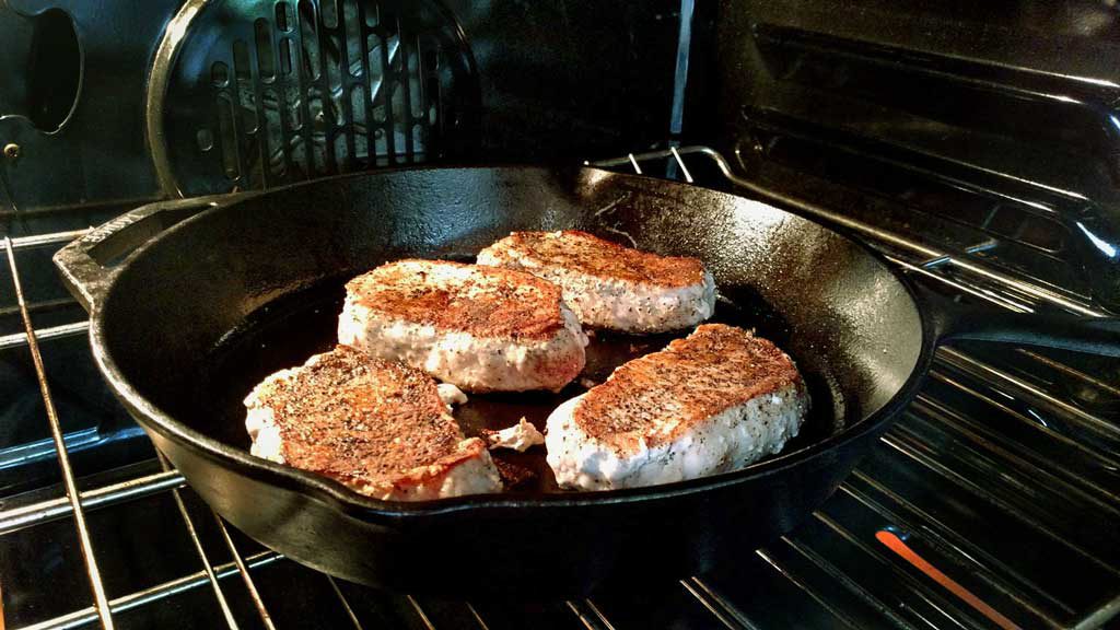 This great southern style Sunday supper may take a little time, but these Kale Stuffed Pork Chops have the potential to change the minds of green-haters. | TheMountainKitchen.com