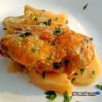 You will love this crock-pot pork chop casserole. Delicious pork chops slow-cooked in a creamy sauce with potatoes, onion and cheese. | TheMountainKitchen.com