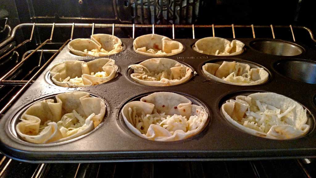 These Mexican Mushroom Taco Cups are the perfect appetizer, snack, or meal. Tortillas baked into cups filled with cheese seasoned mushrooms and garnishes. | TheMountainKitchen.com