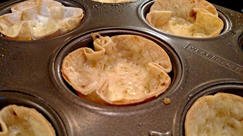 These Mexican Mushroom Taco Cups are the perfect appetizer, snack, or meal. Tortillas baked into cups filled with cheese seasoned mushrooms and garnishes. | TheMountainKitchen.com