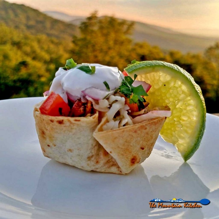 These Mexican Mushroom Taco Cups are the perfect appetizer, snack, or meal. Tortillas baked into cups filled with cheese seasoned mushrooms and garnishes. | TheMountainKitchen.com