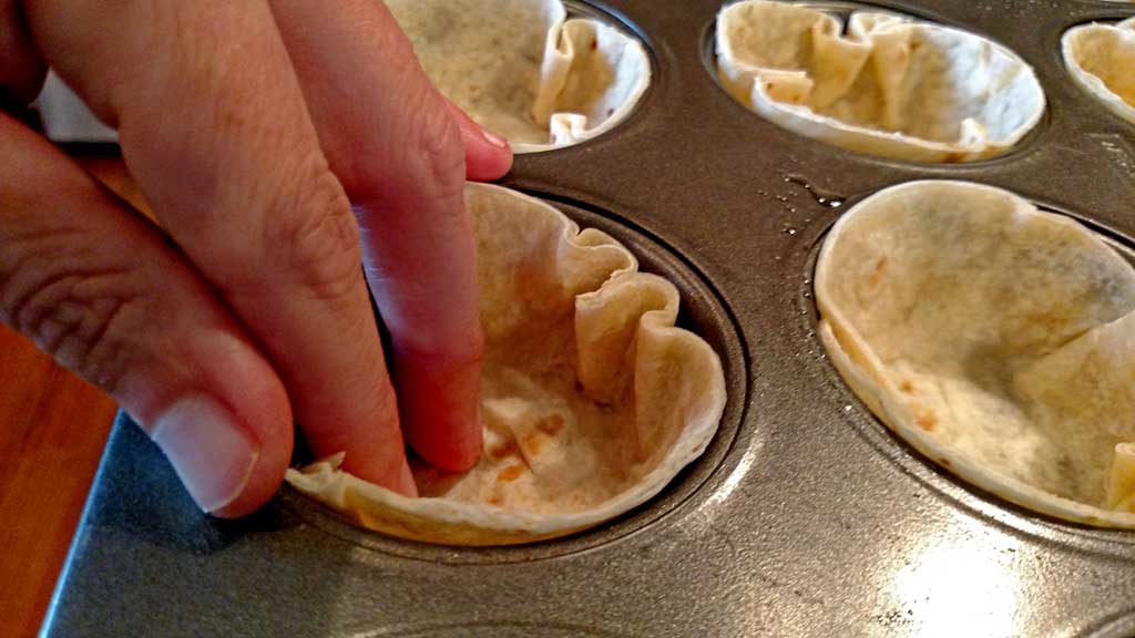 These Mexican Mushroom Taco Cups are the perfect appetizer, snack, or meal. Tortillas baked into cups filled with cheese seasoned mushrooms and garnishes. | TheMountainKitchen.com