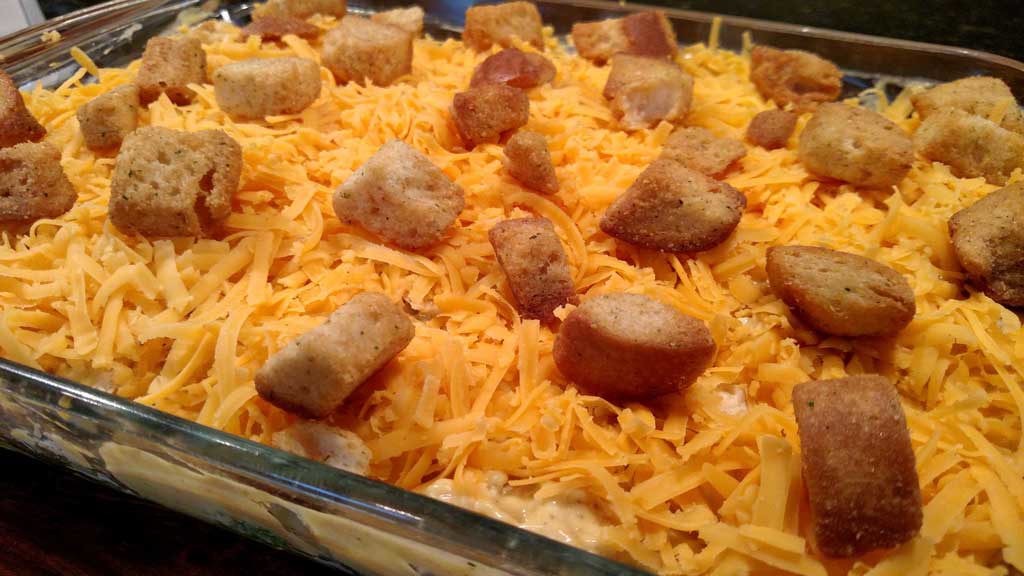Curry Chicken broccoli casserole topped with a curry flavored sauce with lemon juice, topped with cheddar cheese and crunchy garlic flavored croutons. | TheMountainKitchen.com