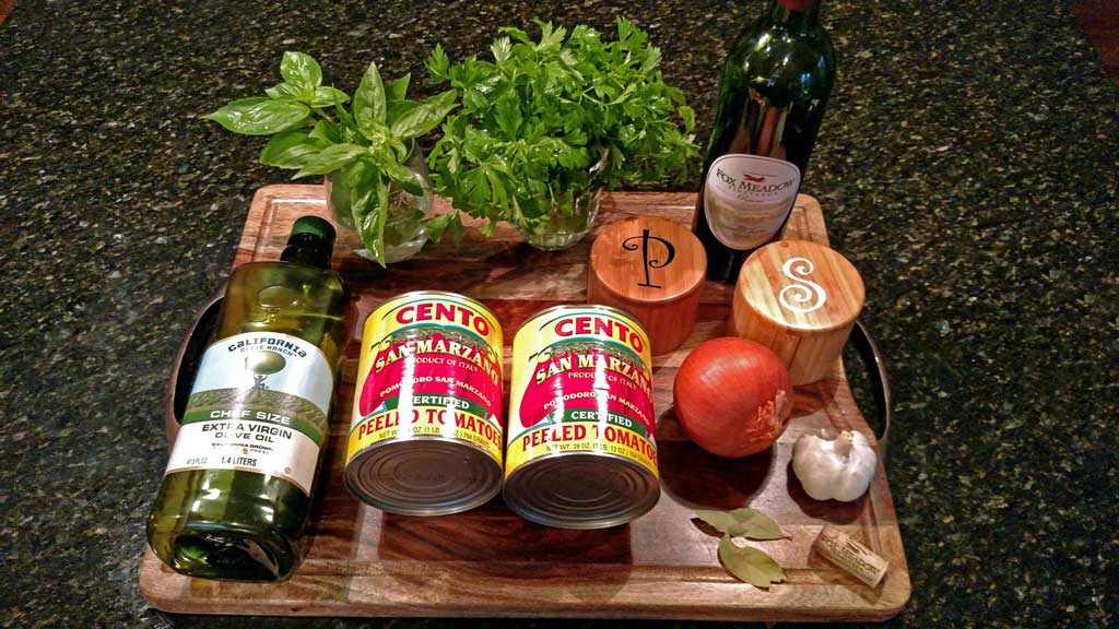 This homemade tomato sauce is made with San Marzano tomatoes, a hearty red wine, and lots of fresh summer basil; the beginning of countless Italian dishes. | TheMountainKitchen.com