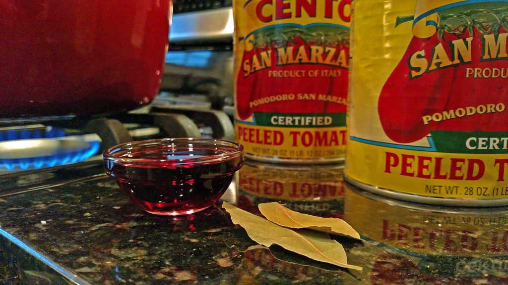 This homemade tomato sauce is made with San Marzano tomatoes, a hearty red wine, and lots of fresh summer basil; the beginning of countless Italian dishes. | TheMountainKitchen.com