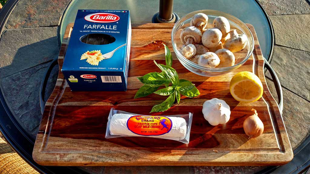 Ingredients to make Mushroom Goat Cheese Farfalle on cutting board