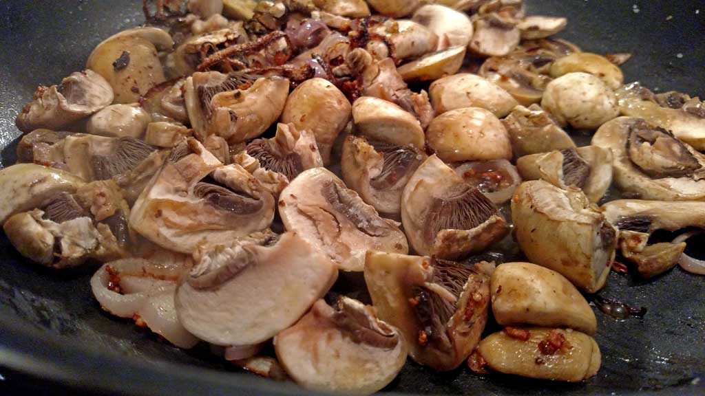 mushrooms cooking in pan