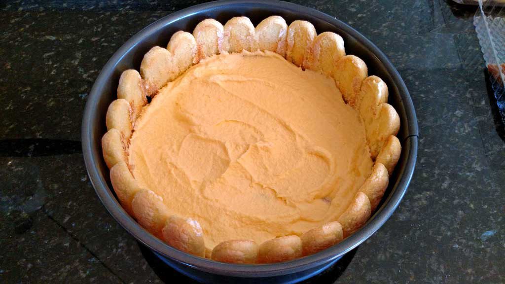 added layer of cream mixture over lady fingers