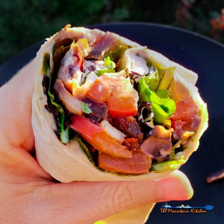 Quick, delicious and fresh, these veggie wraps with red bell peppers, onions and mushrooms sauteed and tucked inside a wrap with lettuce, hummus and goat cheese.