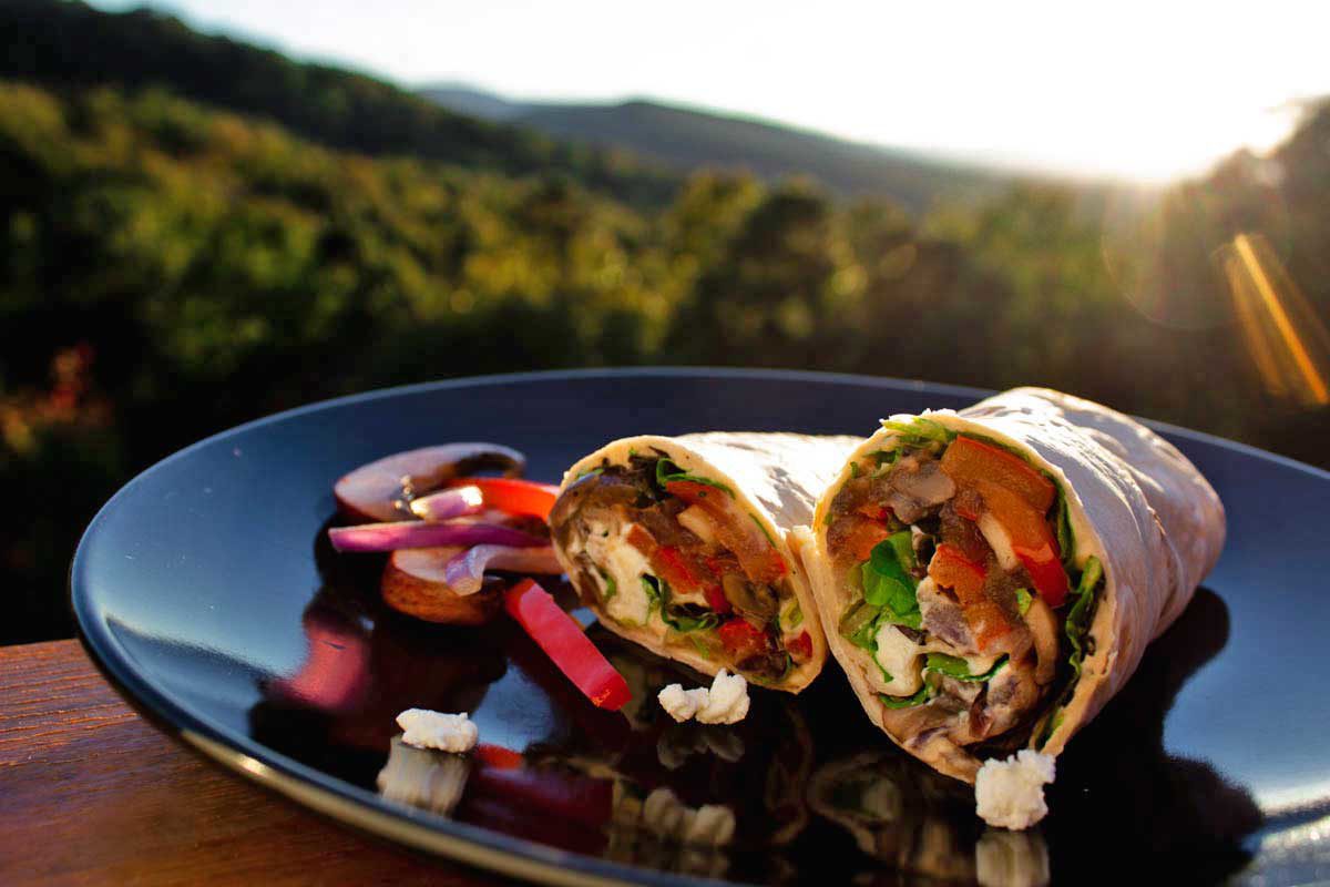 Quick, delicious and fresh, these veggie wraps with bell peppers, onions and mushrooms sautéed and tucked inside a wrap with lettuce hummus and goat cheese.