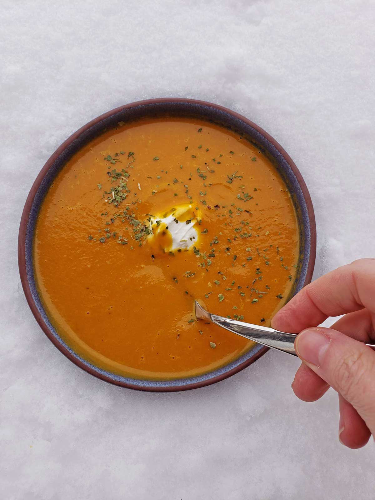 Fresh carrots never tasted better, than in this Curried Carrot-Coconut Soup! Roasted carrots, onions and garlic, puréed with hints of curry, in coconut milk